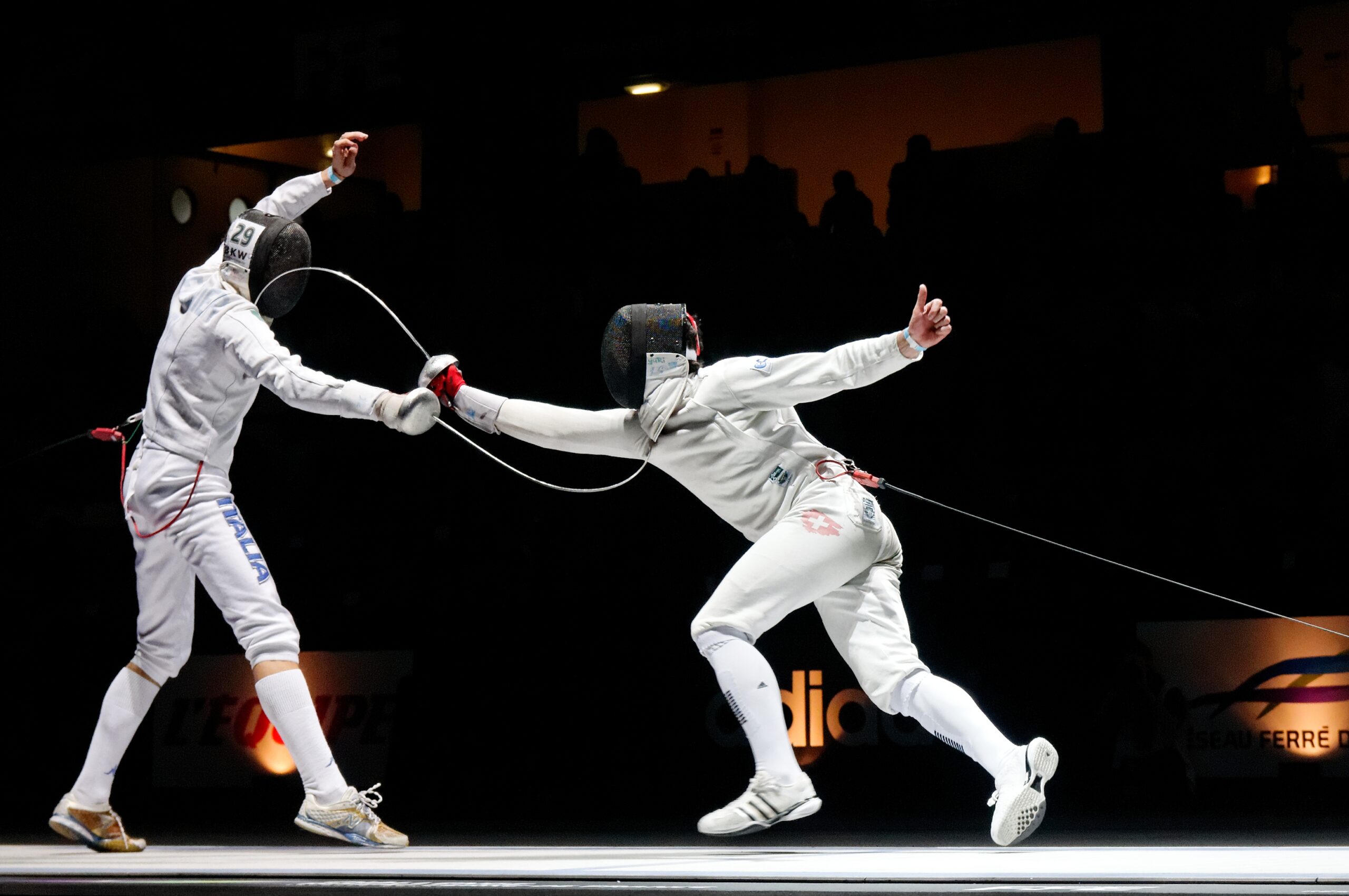crossword clue fencing swords